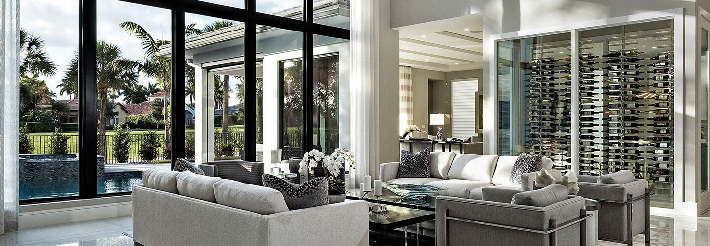 living room with custom wine closet and impact floor to ceiling windows