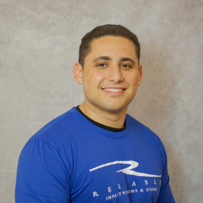 Reliable Impact Team Member Francisco in blue long sleeve shirt